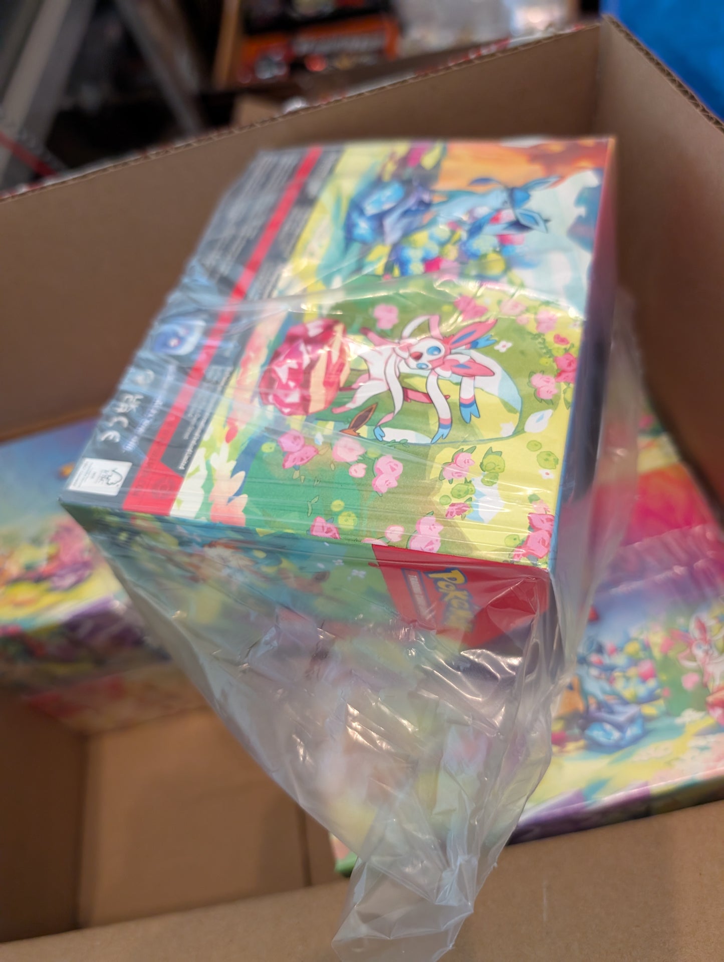 Pokemon TCG: Scarlet and Violet Prismatic Evolutions Mini Tin Display